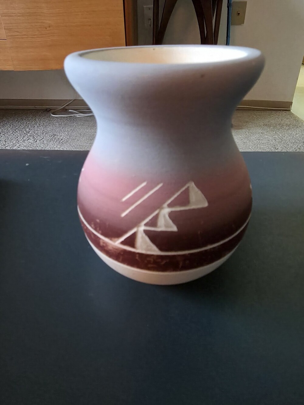 Vintage hand-etched Sioux Pottery vase featuring a muted blue-to-pink gradient
